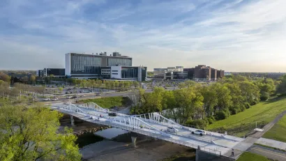 Aerial view of Fall Creek bridge in Indianapolis with bike lanes and walking paths.