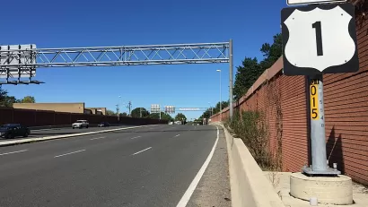 Wide asphalt road with "North Route 1" sign