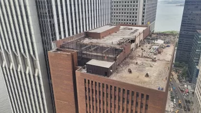 Aerial view of rooftop of 25 Water Street building in New York City with redevelopment work going on on rooftop.