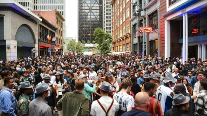 Large crowd on street in San Francisco, California during Oktoberfest festival.
