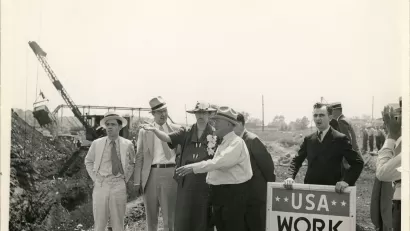 Eleanor Roosevelt talking with a project superintendent in Des Moines, Iowa. June 8, 1936. This project, sponsored by the Works Progress Administration, planned to convert a city dump into a water front park.