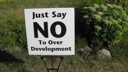 Clse-up of "Just Say No To Over Development" yard sign on green lawn