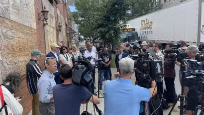 A large group of press and media surround New York City mayoral candidate Eric Adams.