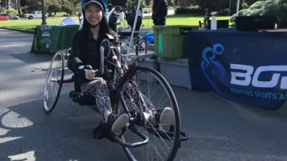 Woman sitting on recumbent bike