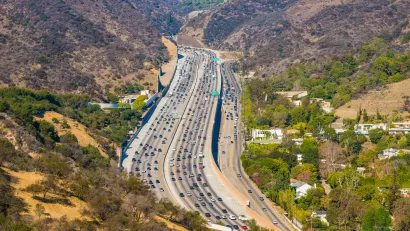Traffic on the 405 interstate freeway through the Sepulveda Pass at Getty Center Drive in Los Angeles, California