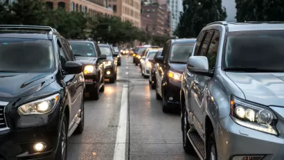 Close-up of black and gray SUVs in New York City traffic