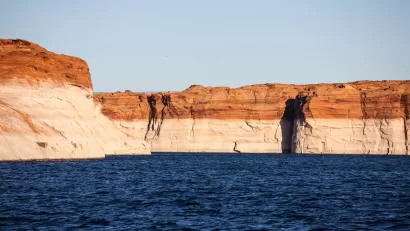 "Bathtub ring" showing low water level on red rocks at Lake Powell, Arizona