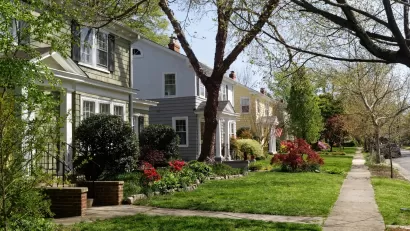 Two-story houses on tree-lined street in Richmond, Virginia