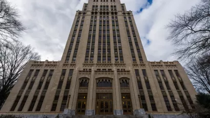 View looking up at high-rise Art Deco Atlanta City Hall building.