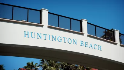 'Huntington Beach' sign on pedestrian bridge over Pacific Coast Highway.