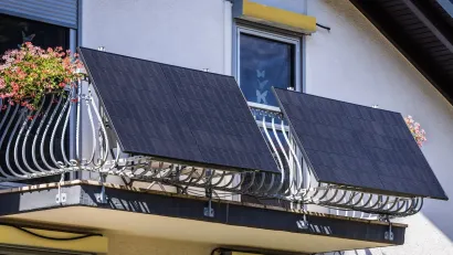 Solar panels installed on wrought iron balcony in Germany.