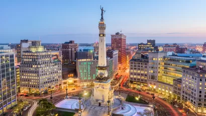 Aerial view of statue on top of tall obelisk in downtown Indianapolis, Indiana.