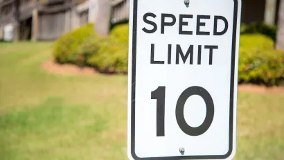 Close-up of 10 mph speed limit sign.