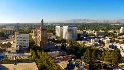 Aerial view of San Jose, California with mountains in background.