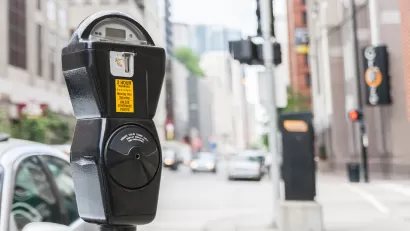 Close-up of standard grey parking meter on Chicago street.