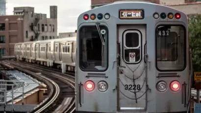 Silver train on elevated rail in Chicago, Illinois.