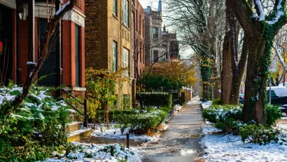 Chicago sidewalk with brick homes in winter.