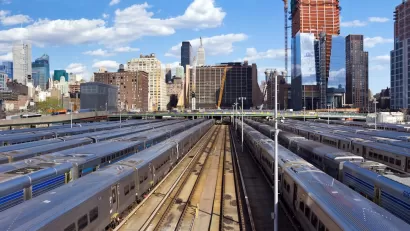 View of trainsin Hundson Yards and New York City skyline.