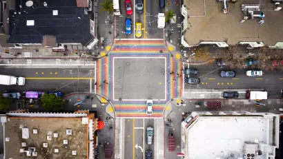 Bird's eye view of rainbow-colored crosswalk in the Castro district in San Francisco, California.