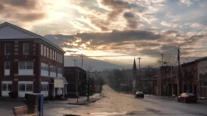 View of street in small town of Camillus, New York on a cloudy day.