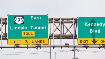Close-up of green freeway sign for Lincoln Tunnel in New Jersey.