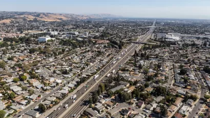 Aerial view of highway through neighborhood in Oakland, California.