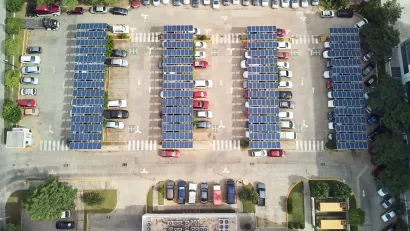 Bird's eye view of parking lot with solar panel canopies