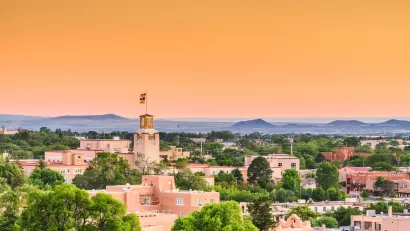 Aerial view of historic core of Santa Fe, New Mexico at dusk.