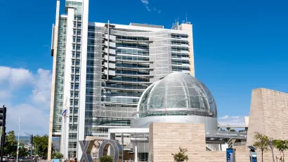 San Jose, California city hall with glass dome in front of modern multistory building.