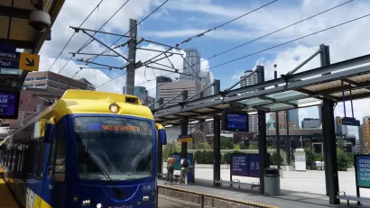 Blue and yellow light rail train at station in Minneapolis, Minnesota