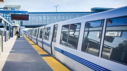 White BART public transit train at Coliseum station in Oakland, California.