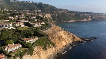 Aerial view of Rancho Palos Verdes coastal community with large homes on coastal bluffs on Pacific Ocean.