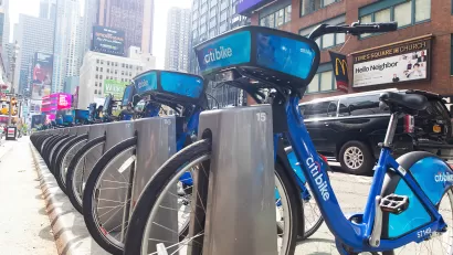 Blue Citi Bike bike share bikes parked at a station near Times Square in New York City