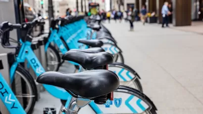 Close-up of town of blue Divvy bike share bikes parked at station in Chicago, Illinois.