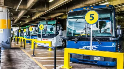 Row of blue intercity buses parked at Washington D.C. Union Station.