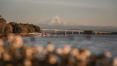 View of Interstate 205 bridge over Columbia River with Mt. Hood in background.