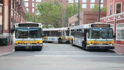 Multiple MBTA buses parked in Cambridge, Massachusetts.