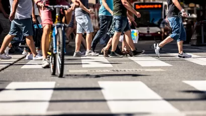 Low close-up of busy city crosswalk in Vienna, Austria.