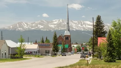 Church with tall steeple in rural Colorado.