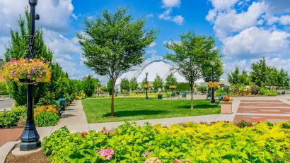 Lush Five Rivers Metropark in Dayton, Ohio with flowers and green trees on a sunny day.