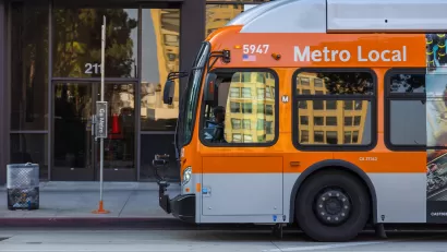 Orange Los Angeles Metro bus on city street