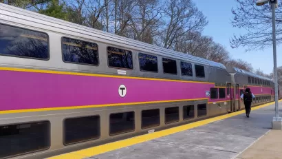 Silver commuter train with purple stripe in Boston, Massachusetts