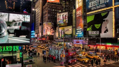 Times Square with Broadway billboards at night.