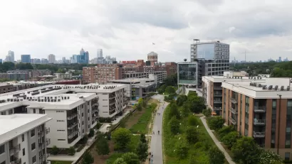 Aerial view of Atlanta BeltLine greenway with multistory buildings one ither side