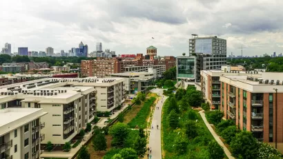 Aerial view of the Atlanta Beltline walking and biking trail with mid-rise buildings on either side.