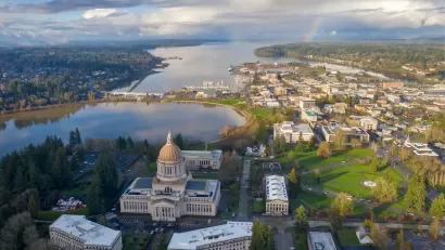 Aerial view of Olympia, Washington with state cpaitol dome in foreground on a somewhat cloudy day.