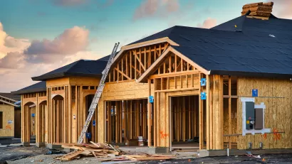 Wood-frame houses under construction.