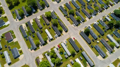 Aerial view of manufactured homes on green lawn.