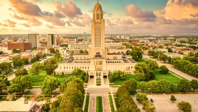 Aerial view of Nebraska state capitol and downtown Lincoln, Nebraska in golden light.