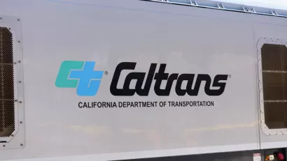 Close-up of Caltrans logo on white passenger train